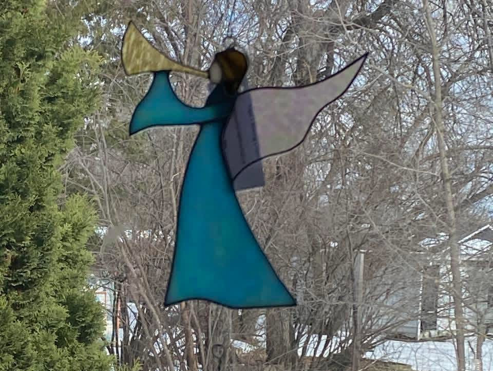 Angel Blowing A Horn
